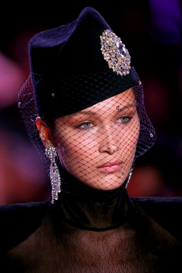 Bella Hadid hits the Paris runway in a see-through black top - Photos