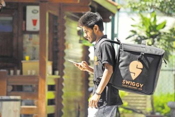 A delivery boy for Swiggy Swiggy Rooms