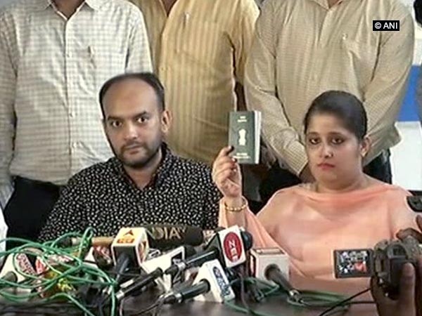 The interfaith couple Tanvi Seth flashing her passport after being harassed by an officer at the Lucknow Regional Passport Office