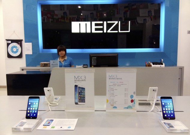 A shop assistant waits for customers at a Meizu store