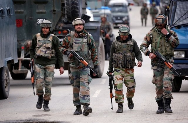Indian army soldiers patrol a street near a site of a gunbattle between Indian security forces and militants in South Kashmir. indian army