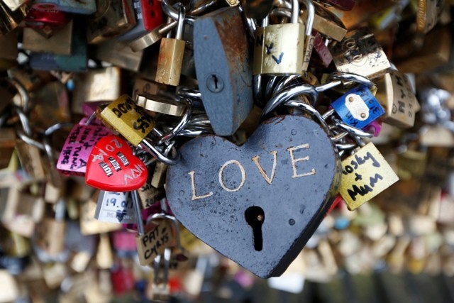 Thousands of padlocks clipped by lovers are seen on the fence of the Pont des Arts over the River Seine in Paris February 13, 2014 on the eve of Valentine's Day. (Reuters) Valentine's Day
