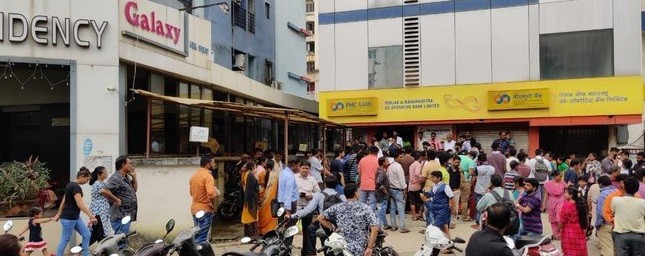 Panic-stricken customers have been gathering in front of Punjab Maharashtra Cooperative Bank (PMC Bank) branches after the Reserve Bank of India (RBI) restricted withdrawals. Customers panic after RBI intervention in PMC Bank