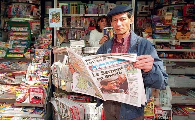 Charles Sobhraj reading an article about him in a French newspaper Charles Sobjraj