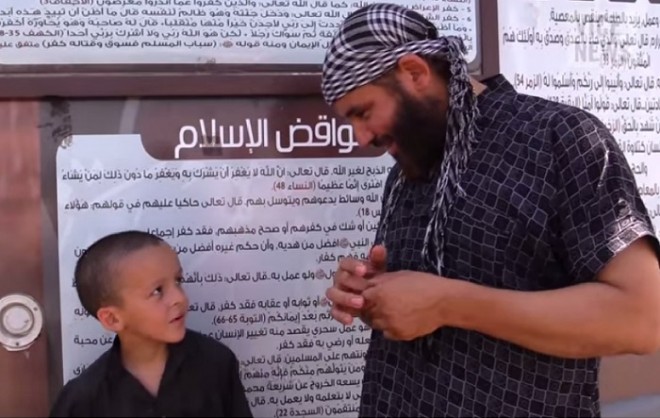A Belgian ISIS militant with his son in Syria