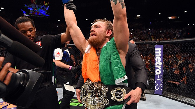 Conor McGregor is presented the gold by UFC President Dana White after a bloody main event at UFC 189 McGregor UFC 189
