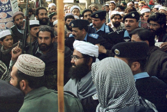 JeM chief Maulana Masood Azhar (C), after being freed by India during 1999 Indian Airlines hijack, is surrounded by Pakistani police and his armed guards at Islamabad's Lal Mosque (Red Mosque) in Melody Market January 27. JeM chief Maulana Masood Azhar
