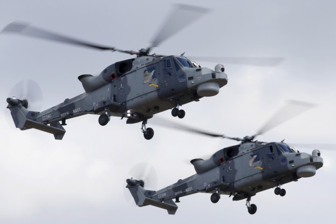 AgustaWestland Wildcat HMA.2 helicopters of the Black Cats Helicopter Display Team, of the British Royal Navy Fleet Air Arm, take part in a display during the Malta International Airshow at Malta International Airport, outside Valletta, Malta, September 2