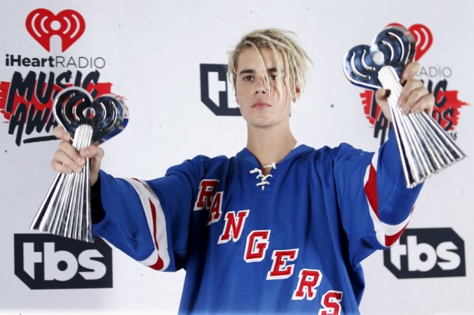 Justin Bieber could be on the verge of an emotional breakdown. Pictured: Recording artist Justin Bieber poses with his Dance Song of The Year Award for Justin Bieber