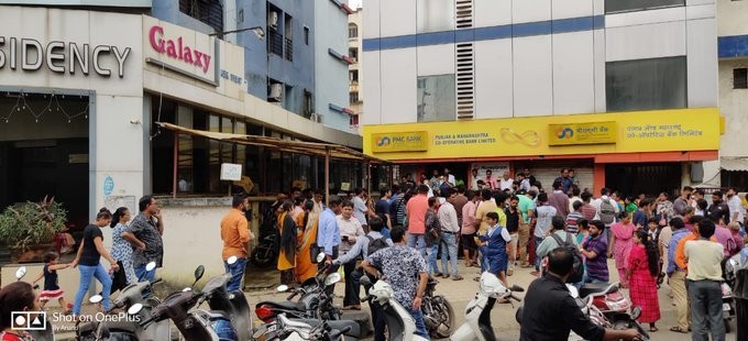 Panic-stricken customers have been gathering in front of Punjab Maharashtra Cooperative Bank (PMC Bank) branches after the Reserve Bank of India (RBI) restricted withdrawals. PMC Bank customers panic after RBI restricts withdrawals