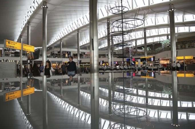 A view of the departure lounge is reflected in Terminal 2 at Heathrow Airport in London. Heathrow Airport