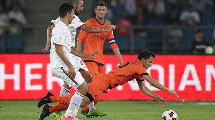 Delhi Dynamos forward Alessandro Del Piero goes down under the challenge of FC Pune City defender in their ISL game Alessandro Del Piero Delhi Dynamos FC Pune City