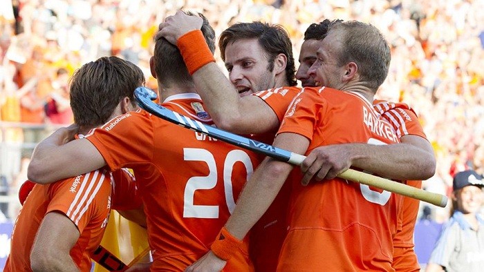 Netherlands hockey team celebrates after scoring against Germany in the World Cup. Netherlands Hockey Team