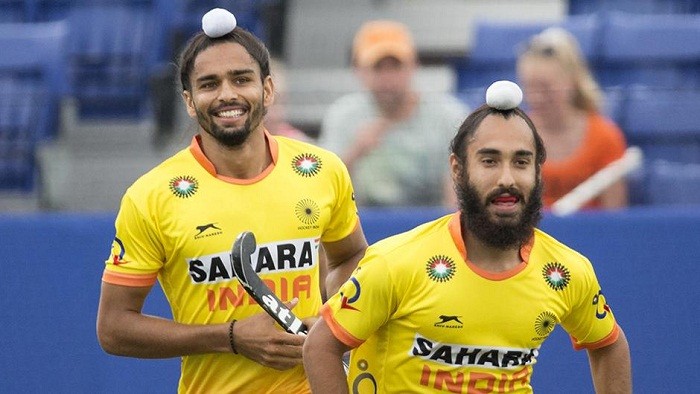 Indian striker Akashdeep Singh (left) celebrates after scoring against Malaysia Akashdeep Singh Hockey