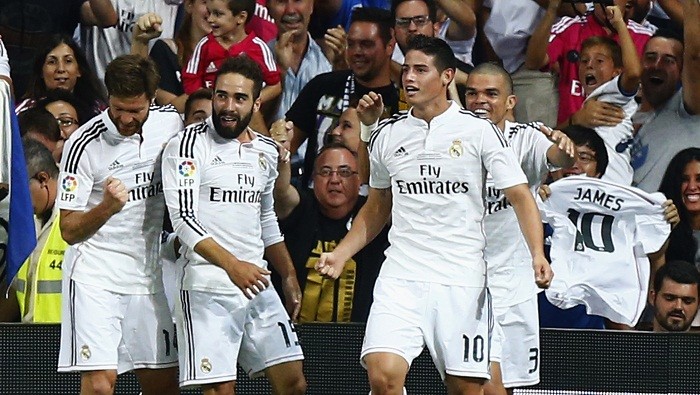 James Rodriguez celebrates with his Real Madrid teammates after scoring the opening goal against Atletico Madrid James Rodriguez Real Madrid Carvajal Pepe Ramos