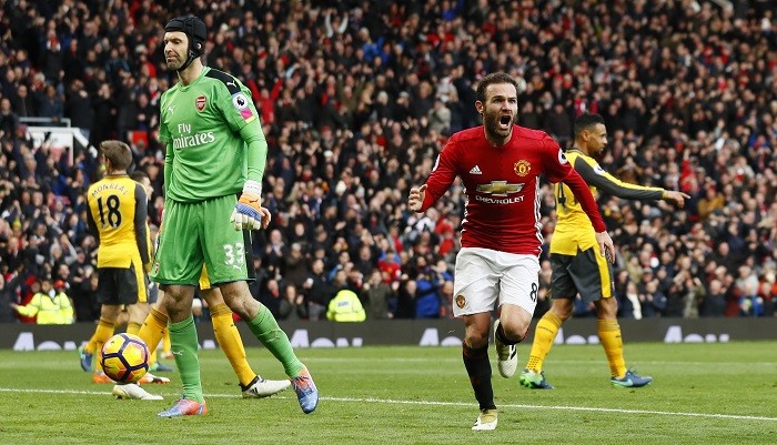 Arsenal goalkeeper Petr Cech looks disappointed as Juan Mata celebrates scoring for Manchester United in their Premier League game, November 19, 2016 Petr Cech Arsenal Juan Mata Manchester United