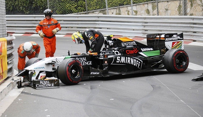 Force India's Sergio Perez leaves his car after crashing in the Monaco Grand Prix. Sergio Perez Force India