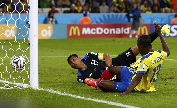 Ecuador forward Enner Valencia squeezes the ball past Honduras goalkeeper Noel Valladares in their FIFA World Cup 2014 Group E game, 20 June Enner Valencia Ecuador Noel Valladares Honduras