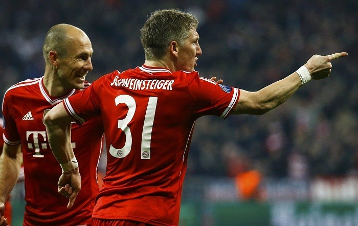 Bastian Schweinsteiger and Arjen Robben celebrate a goal against Arsenal, 11 March. Reuters Schweinsteiger Robben Bayern Munich