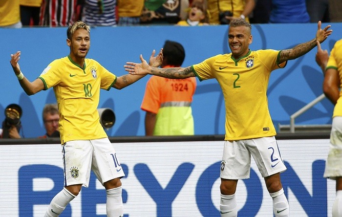 Neymar celebrates with Dani Alves after scoring against Cameroon, 23 June Neymar Dani Alves Brazil