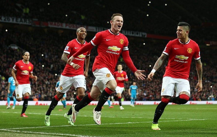 Manchester United's Rooney celebrates with teammates after scoring the first goal against Sunderland from the penalty spot Wayne Rooney