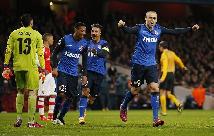 Monaco striker Dimitar Berbatov celebrates after scoring the second goal during his side's clash against Arsenal in the first leg round of sixteen of the Champions League at the Emirates Arsenal vs Monaco