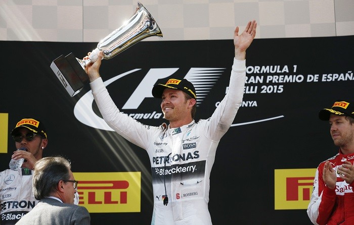 Mercedes' Nico Rosberg celebrates his win in the Spanish Grand Prix on the podium with the trophy Nico Rosberg