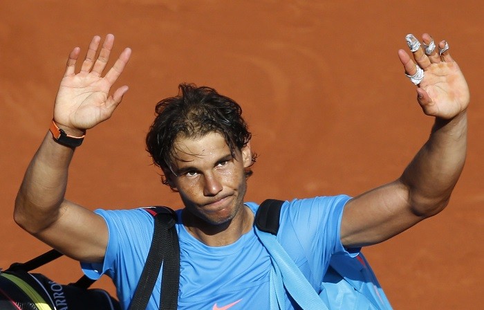 Rafael Nadal waves goodbye to the crowd after getting knocked out in the French Open quarterfinals by Novak Djokovic Rafael Nadal French Open 2015 Quarterfinals