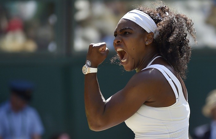 Serena Williams lets out a roar after winning a crucial point against Garbine Muguruza in the Wimbledon final Serena Williams Wimbledon 2015