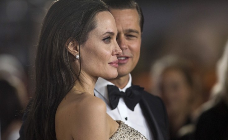 Director and cast member Angelina Jolie and her husband and co-star Brad Pitt pose at the premiere class= Brad Pitt and Angelina Jolie in 2015