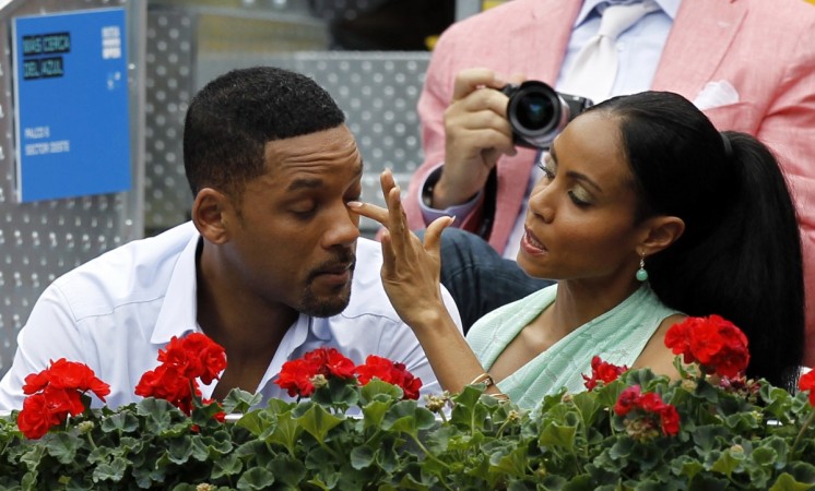 Jada Pinkett Smith making sure her husband is photo-ready. Jada Pinkett Smith making sure her husband is photo-ready.