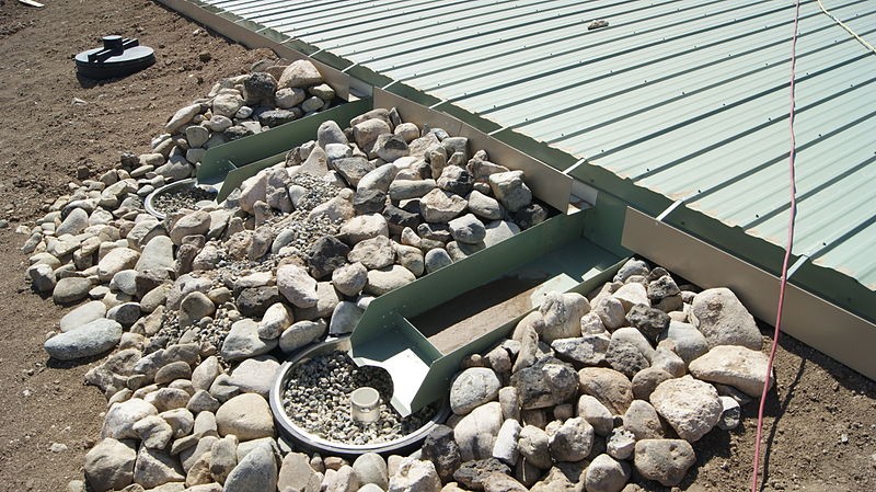 Earthship water catchment scuppers Earthship homes