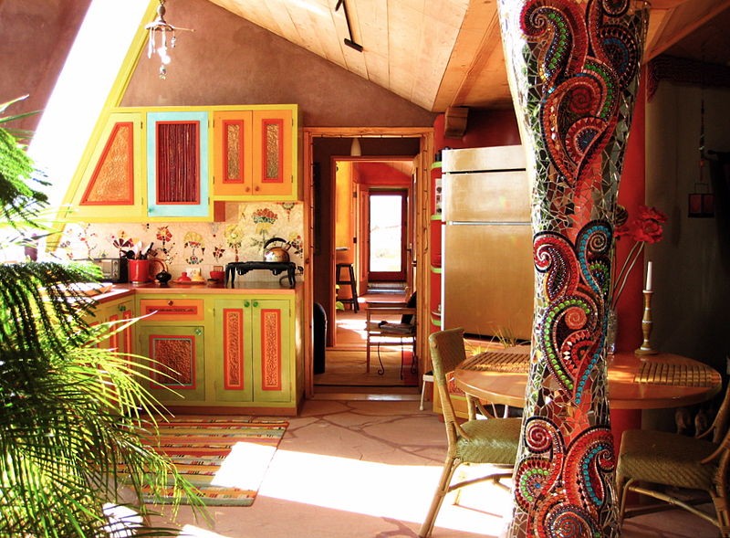 Interior of an Earthship with sun coming in from the south facing windows Earthship home
