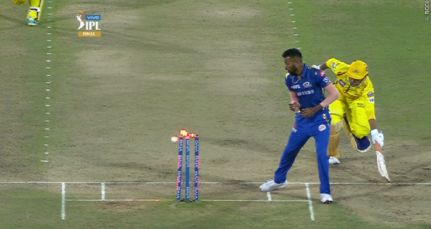 This angle clearly shows the bails being broken before Dhoni makes his crease Dhoni run out