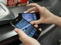 a-customer-holds-iphones-she-purchased-shortly-after-the-phone-went-on-sale-with-the-verizon-wireless-network-in-boca-raton-florida-february-10-2011