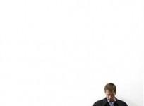 a-visitor-checks-a-mobile-phone-under-a-nokia-logo-at-mobile-world-congress-in-barcelona