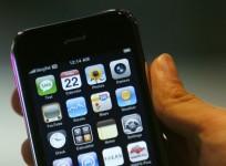 a-user-holds-a-smartphone-as-he-checks-the-apps-collection
