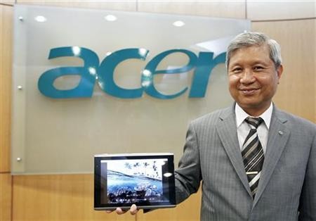Acer's Chairman J.T. Wang poses with the new 10-inch Acer tablet PC after an interview with Reuters in Taipei December 14, 2010.
