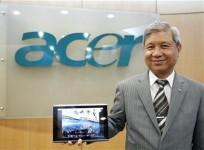 acer039s-chairman-j-t-wang-poses-with-the-new-10-inch-acer-tablet-pc-after-an-interview-with-reuters-in-taipei-december-14-2010