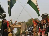 Pakistani Rangers and BSF lower their respective country flags during daily parade in Pakistan India joint check post in Wagah border