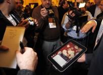 a-man-displays-an-unannounced-lenovo-tablet-computer-at-a-preview-of-the-ces-in-las-vegas