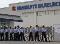 private-security-guards-stand-outside-the-main-entrance-to-the-maruti-suzuki-india-limited-plant-where-workers-are-striking-in-manesar