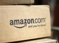 a-box-from-amazon-com-is-pictured-on-the-porch-of-a-house-in-golden