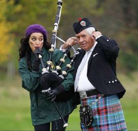Kanishtha Dhankhar blows into the bagpipe, during the Kanishtha Dhankhar