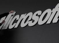 a-worker-prepares-the-logo-on-the-microsoft-stand-on-the-cebit-computer-fair-in-hanover