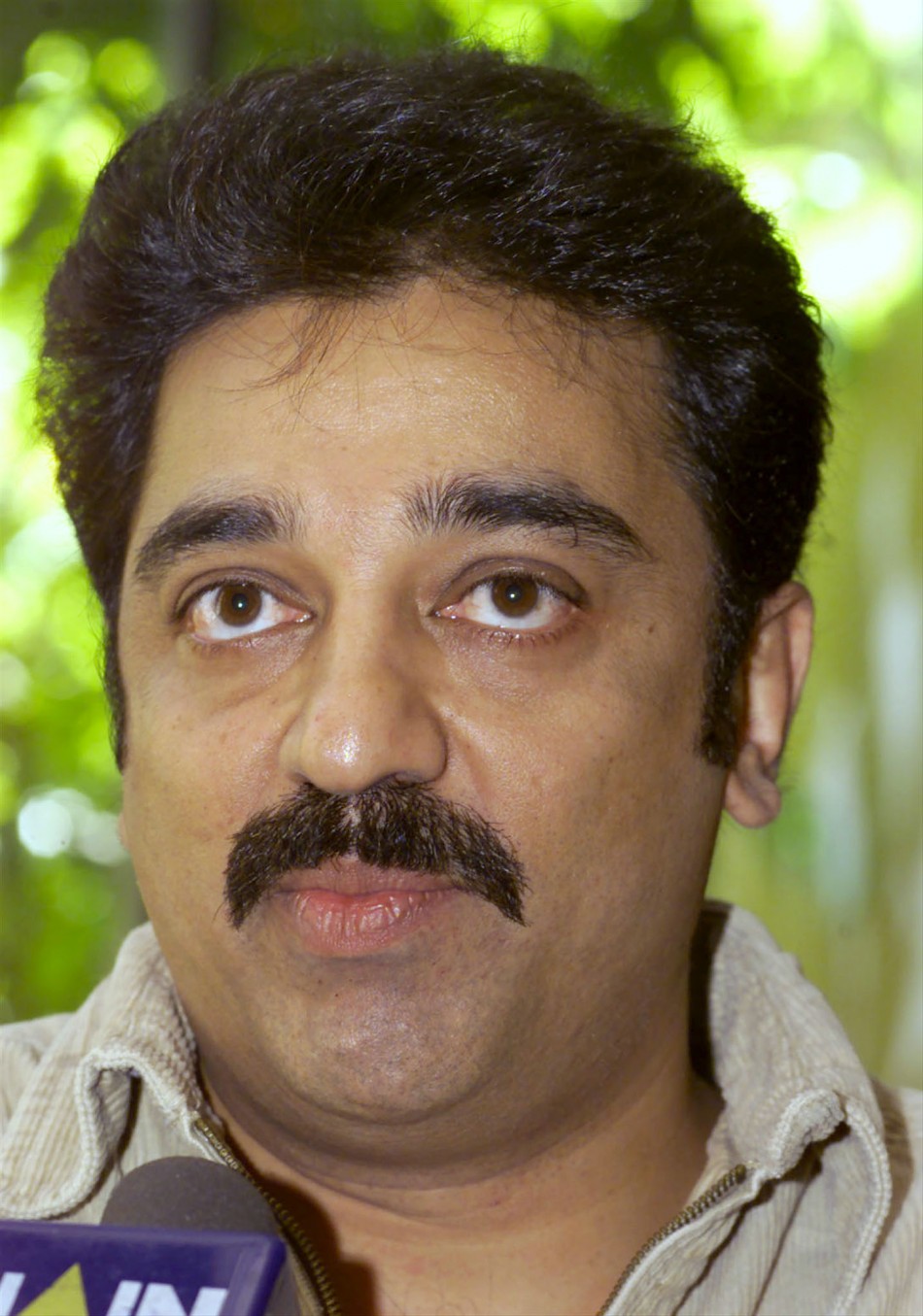 Actor Kamal Haasan talks to the press in New Delhi April 4. Kamal Haasan