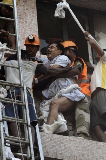 Fire officials rescue a patient from the window. AMRI/Kolkata Fire