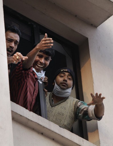 Employees of the AMRI hospital yell out for help. AMRI/Kolkata Fire