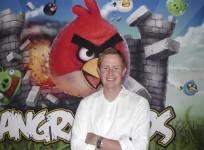 rovio-chief-executive-mikael-hed-stands-in-front-of-an-angry-birds-poster-at-his-companys-offices-in-helsinki