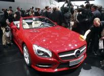 a-worker-removes-fingerprints-from-the-2013-mercedes-benz-sl-on-the-first-press-preview-day-at-the-north-american-international-auto-show-in-detroit-michiganon-the-first-press-preview-day-in-detroit-michigan-january-9-2012